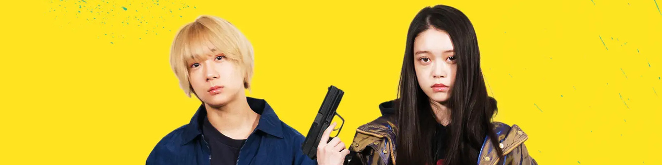L-R: Mahiro Fukugawa (Saori Izawa) and Chisato Sugimoto (Akari Takaishi) stand isolated on a yellow background